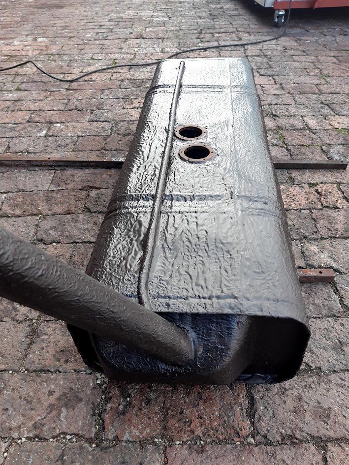 Long fuel tank with finished coating
