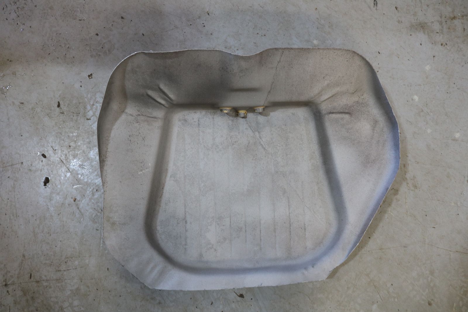 Old car fuel tanks: split open and sandblasted – sandblasted tank half 2